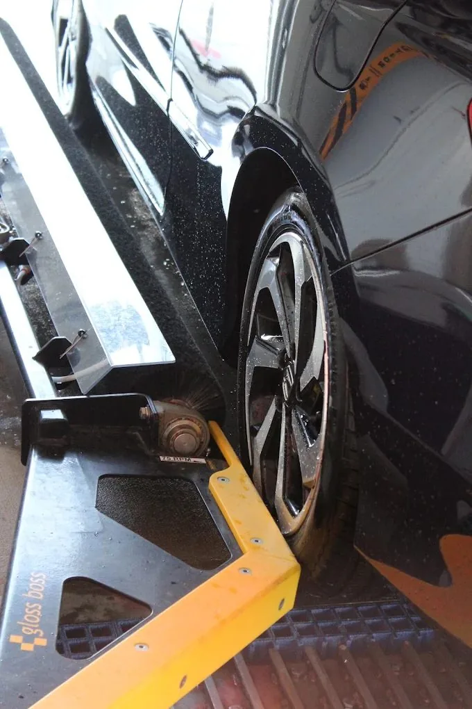 Close-up of wheel and tire cleaning at Elmore Ave